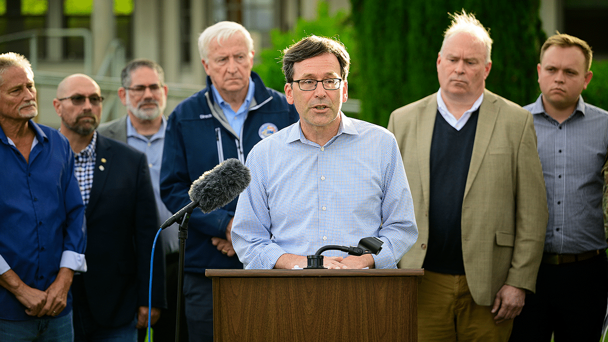 Washington Gov. Bob Ferguson speaks during an outdoor press conference