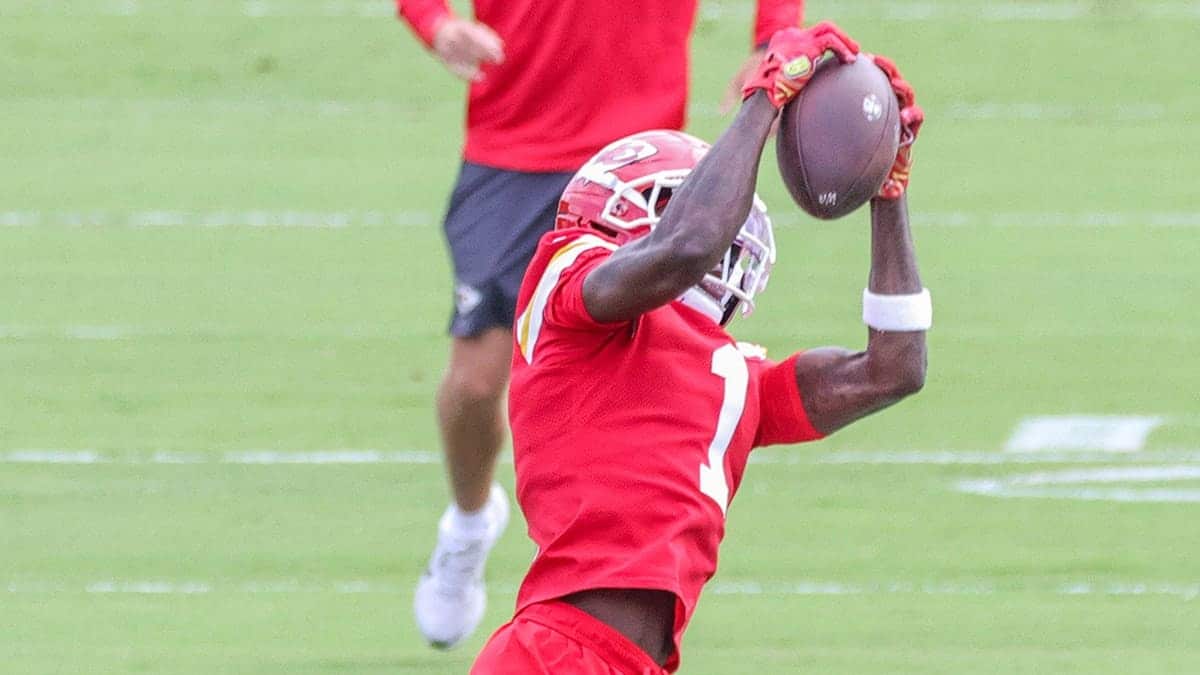 Xavier Worthy catches a pass during a training camp practice