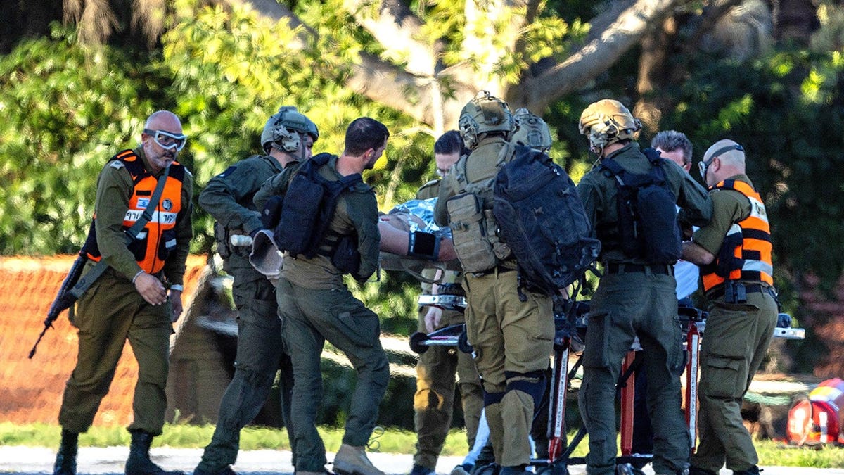 An injured IDF soldier carried to helicopter for evacuation to hospital.