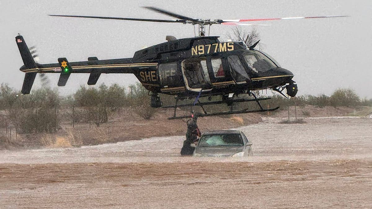People rescued from flooded car in Arizona