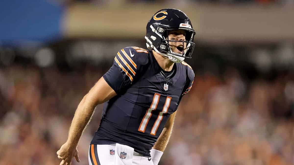 Case Keenum #11 celebrates after a touchdown at Soldier Field.