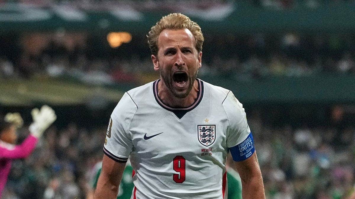 Harry Kane celebrates after scoring a penalty kick for England.