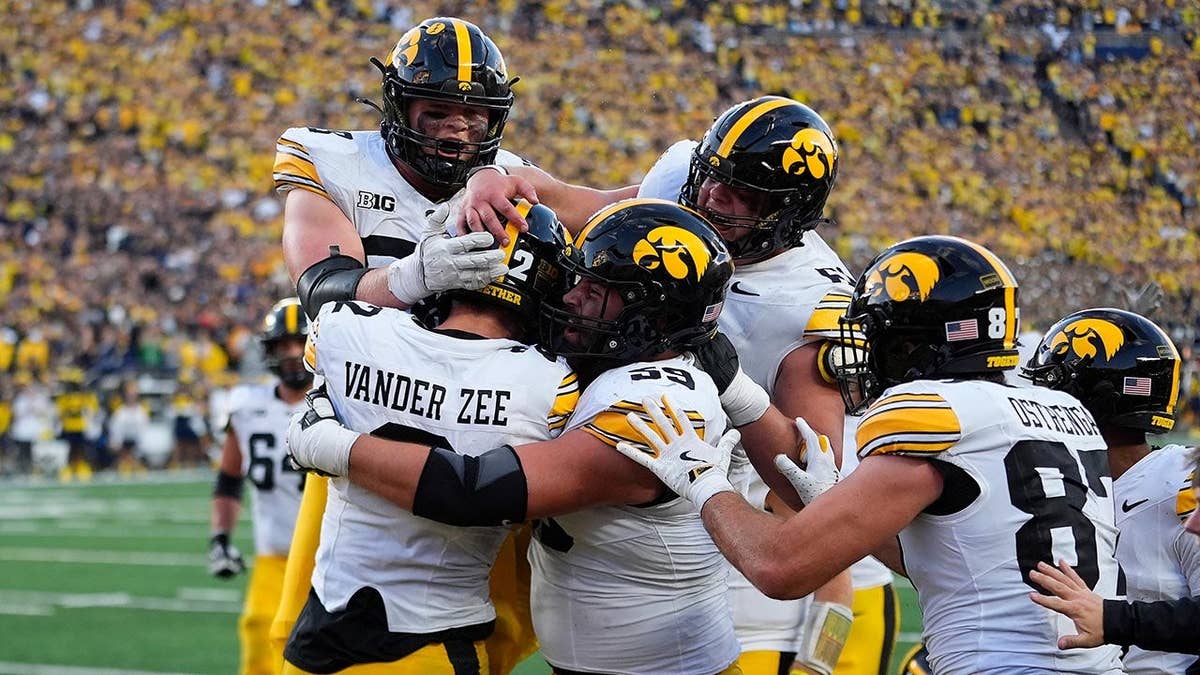 Reece Vander Zee celebrates his touchdown reception for Iowa against Michigan.