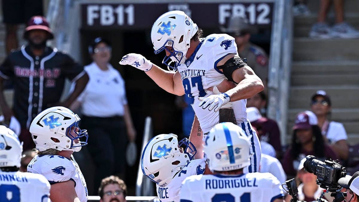 Henry Boyer celebrating after scoring a touchdown