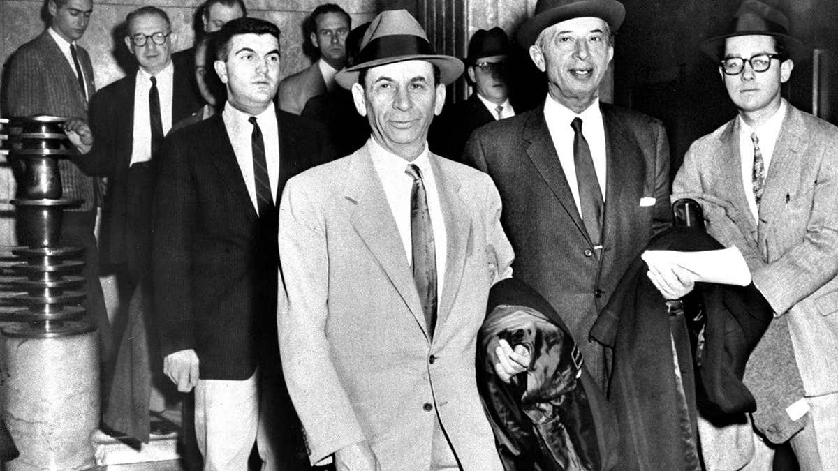 Meyer Lansky sits with his lawyer Morris Polankoff.