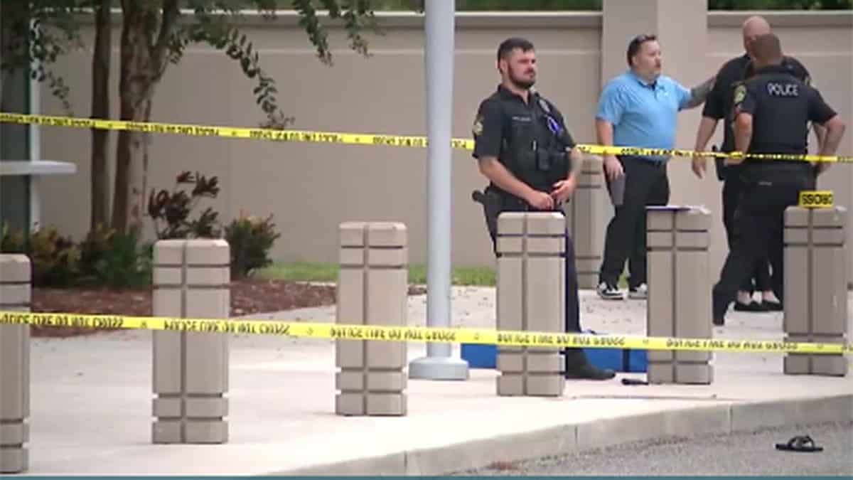Police stand near Port Orange Police Department building