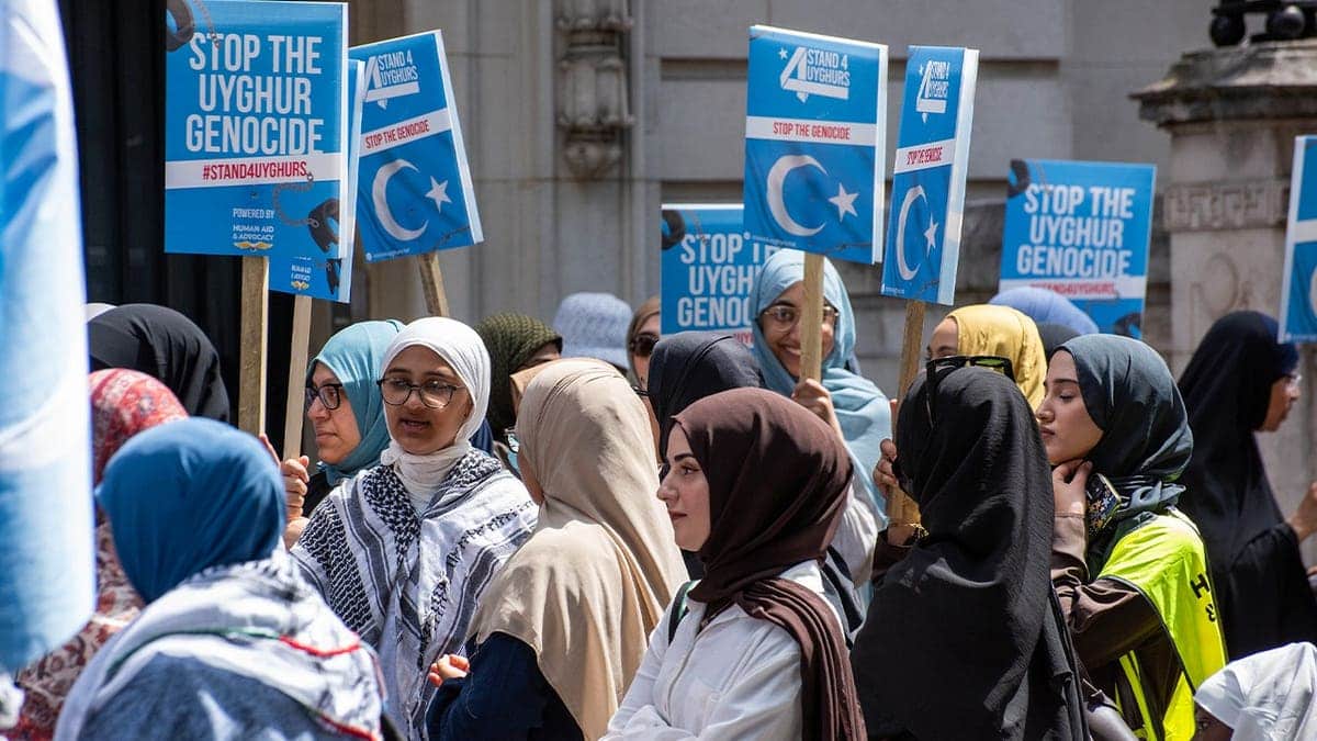 Protesters demonstrate outside the Chinese Embassy in London to protest the systematic oppression of Muslim minorities in Xinjiang, demanding that Beijing dismantle its internment camps and respect basic religious freedom. Fueling the rally was a growing global call to boycott the fast-fashion e-commerce platform Temu, which international investigators and legal complaints accuse of dodging forced-labor trade laws to profit from products heavily linked to state-sponsored Uyghur slave labor.