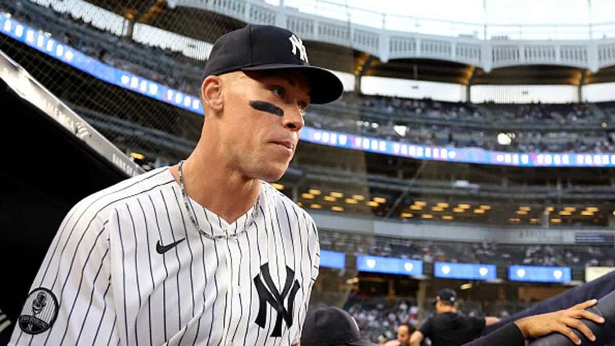 Aaron Judge walks onto the field at Yankee Stadium before a game.