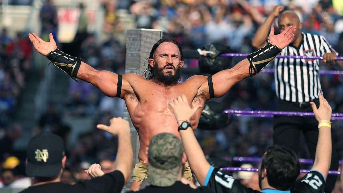Adrian Neville celebrates with fans at Camping World Stadium.