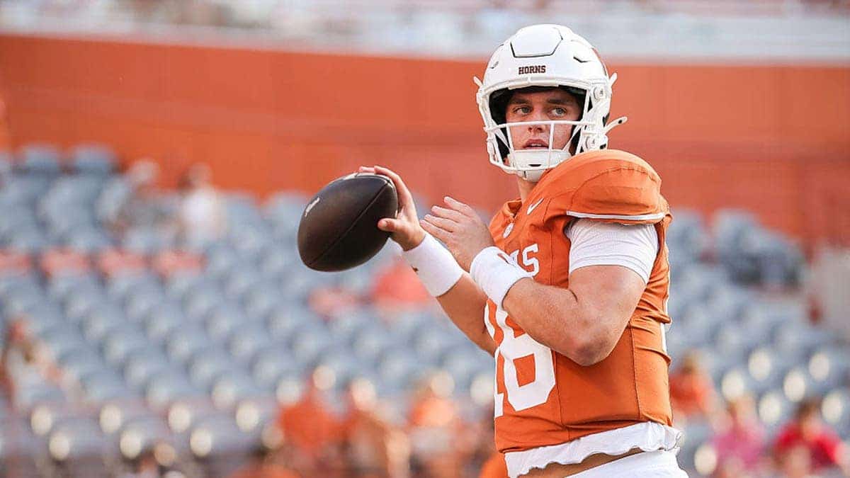 Arch Manning warms up before a game at Darrell K Royal-Texas Memorial Stadium.