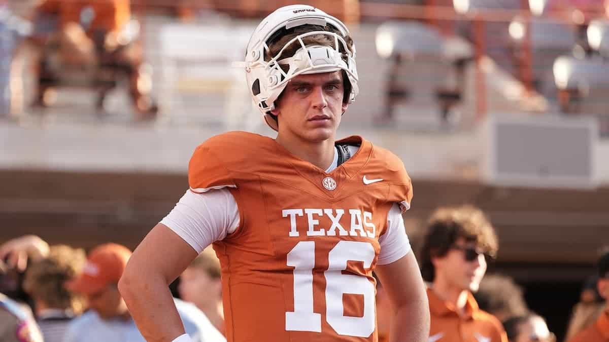 Arch Manning, Texas quarterback, warms up before NCAA football game.