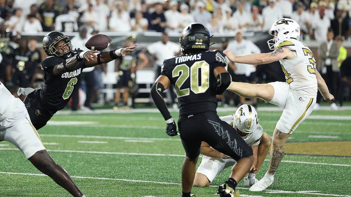 Boo Carter #6 blocks a field goal attempt by Aidan Birr #33 as time expires.