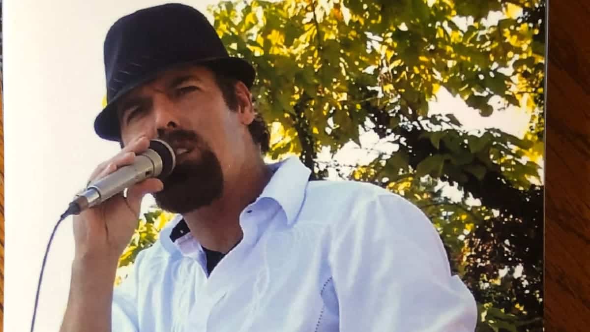 Brian Duckworth singing on stage