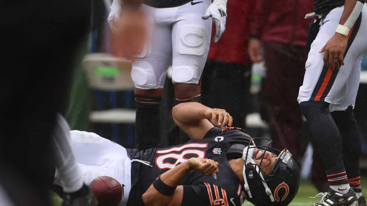 Chicago Bears quarterback Caleb Williams grimaces in pain after going down during a run in the fourth quarter against the Minnesota Vikings on Sunday, Sept. 20, 2026, at Soldier Field in Chicago. (Stacey Wescott/Chicago Tribune/Tribune News Service via Getty Images)