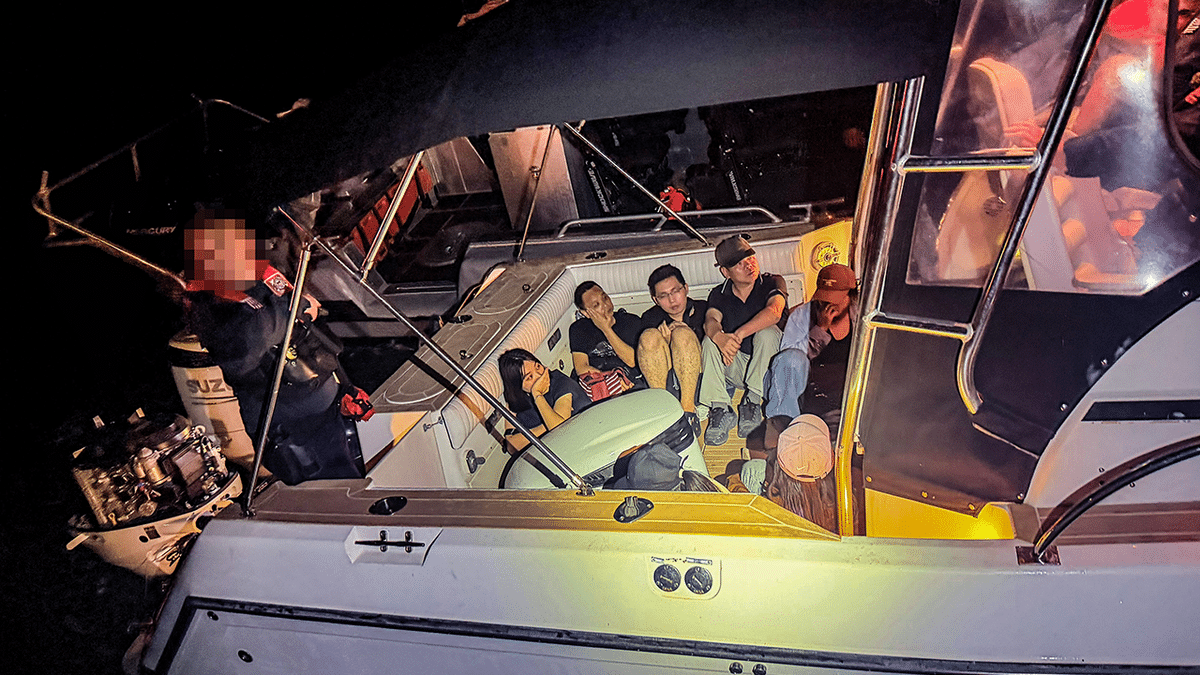 Chinese illegal immigrants being arrested on a boat near Florida coast