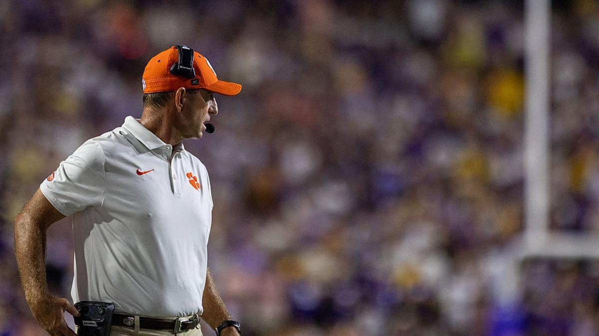 Dabo Swinney stands on the sideline during a Clemson Tigers game at Tiger Stadium.