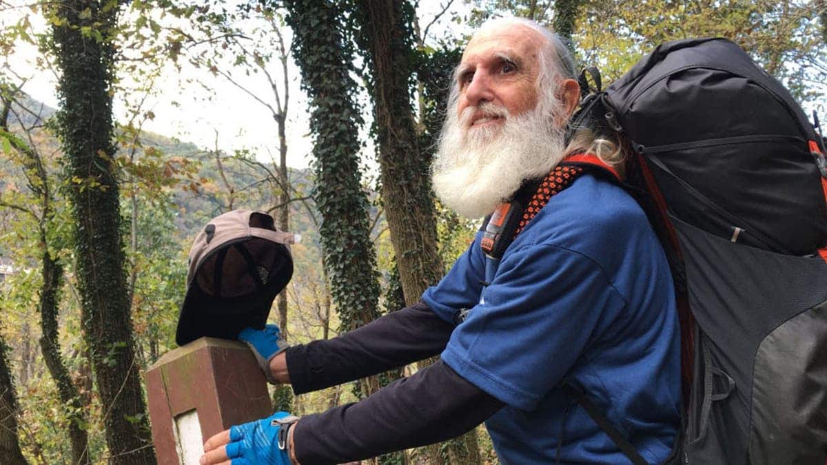 Dale Grey Beard Sanders passes a white blaze marker on the Appalachian Trail near Harpers Ferry.
