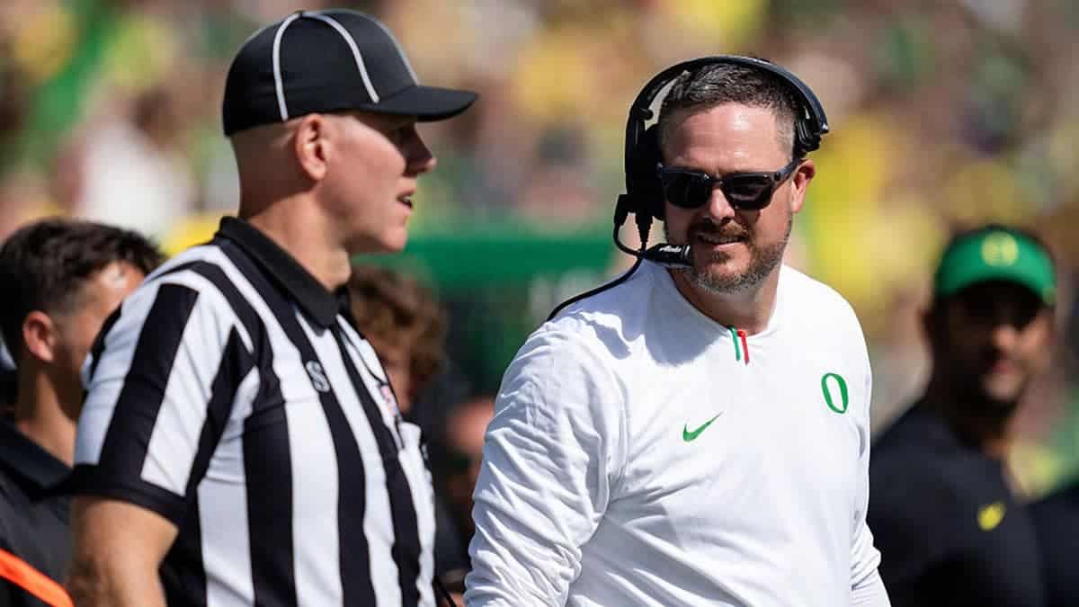 Dan Lanning of the Oregon Ducks talks to one of the referees during the second half of the game against the Boise State Broncos at Autzen Stadium on September 5, 2026 in Eugene, Oregon.