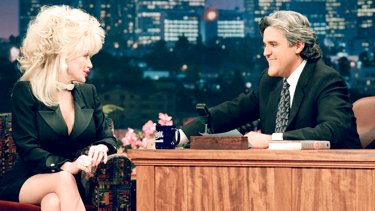 Dolly Parton sits with Jay Leno during