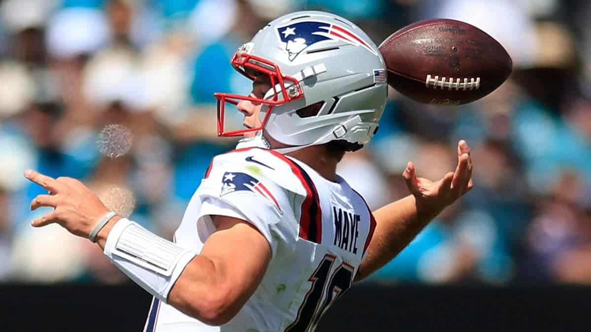 Drake Maye loses the ball on a fumble during an NFL game at EverBank Stadium.