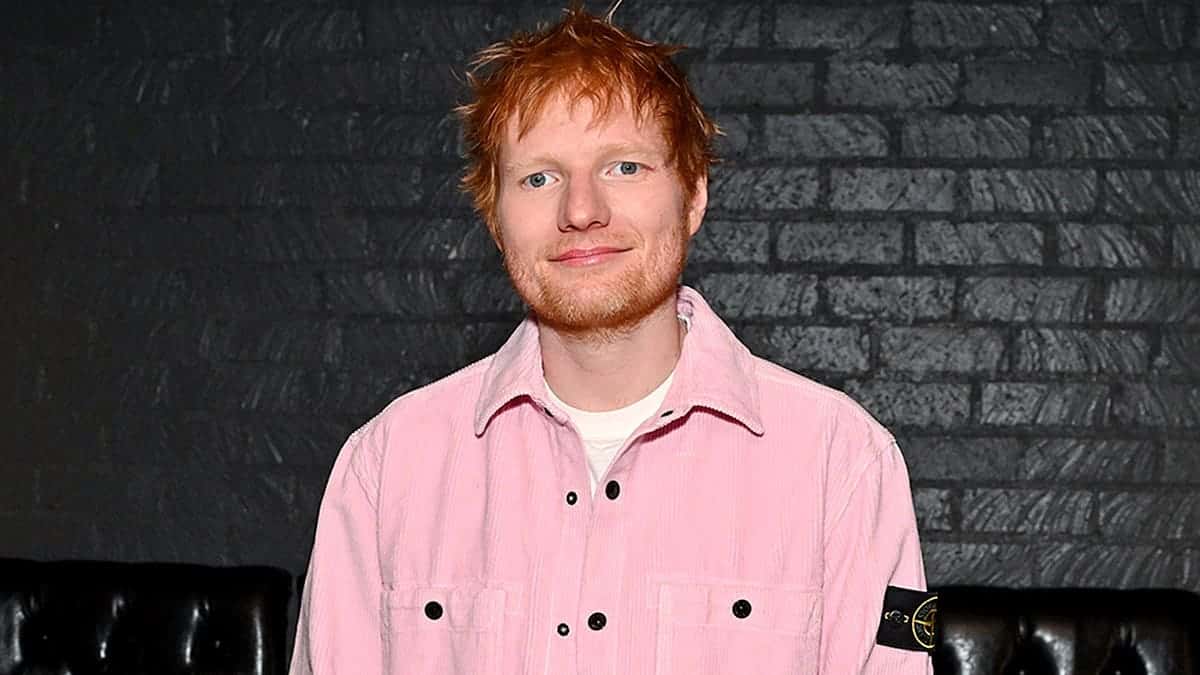 Ed Sheeran stands at an event in Los Angeles.