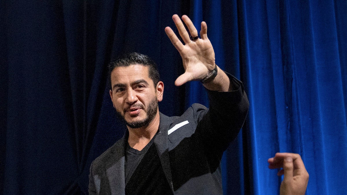 Abdul El-Sayed at event waving