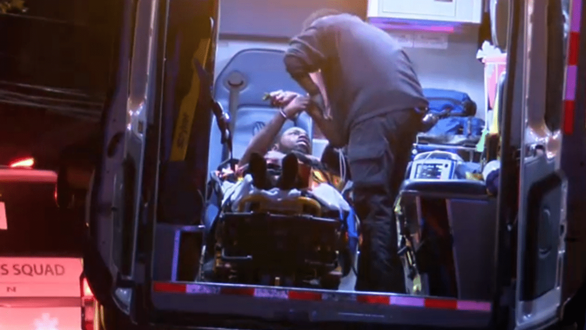 Elijah Hemingway loaded into an ambulance
