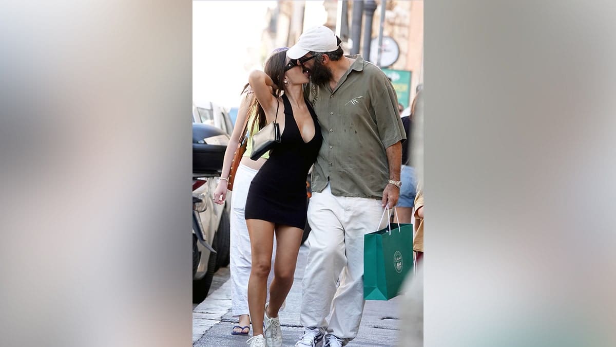 Emily Ratajkowski and Romain Gavras kissing while in Rome.