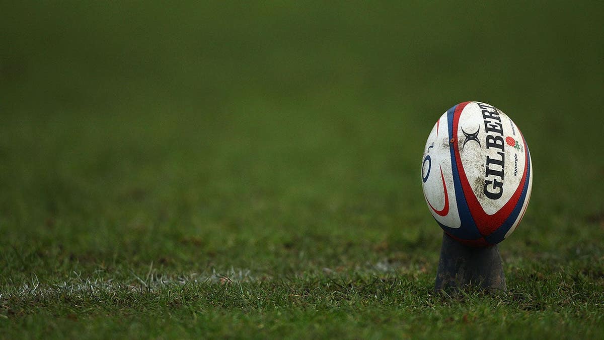 Rugby ball on field during England U18 vs. Australia Schools match in Sale, England.