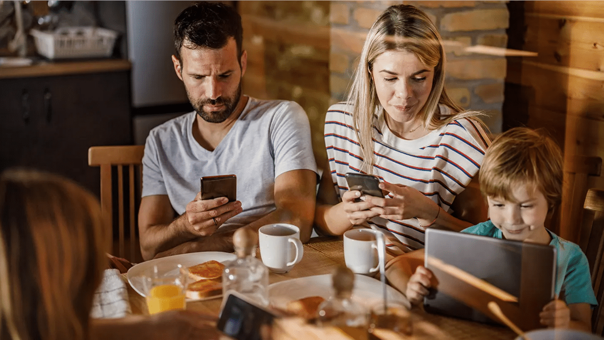 Family on phones during dinner
