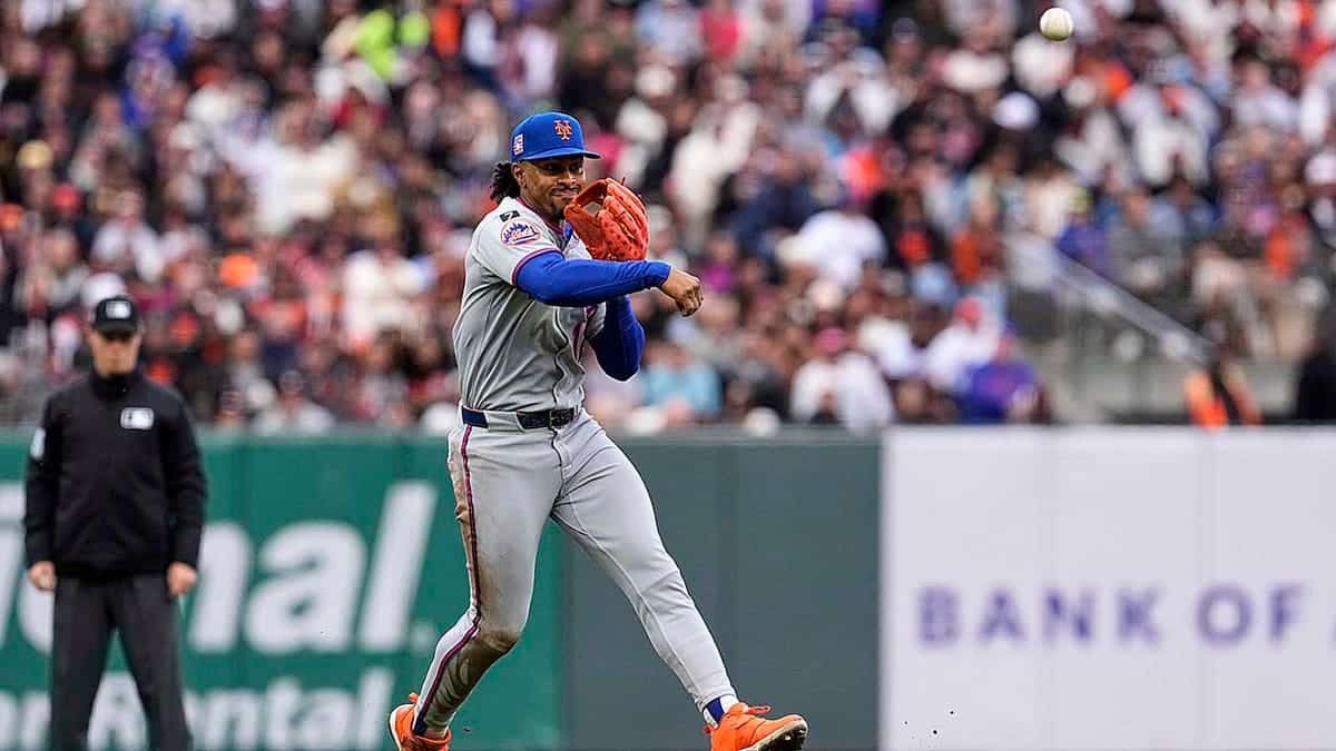 New York Mets shortstop Francisco Lindor throws to first for an out on San Francisco Giants' Heliot Ramos during the first inning of a baseball game in San Francisco, California, on Saturday, July 26, 2025.