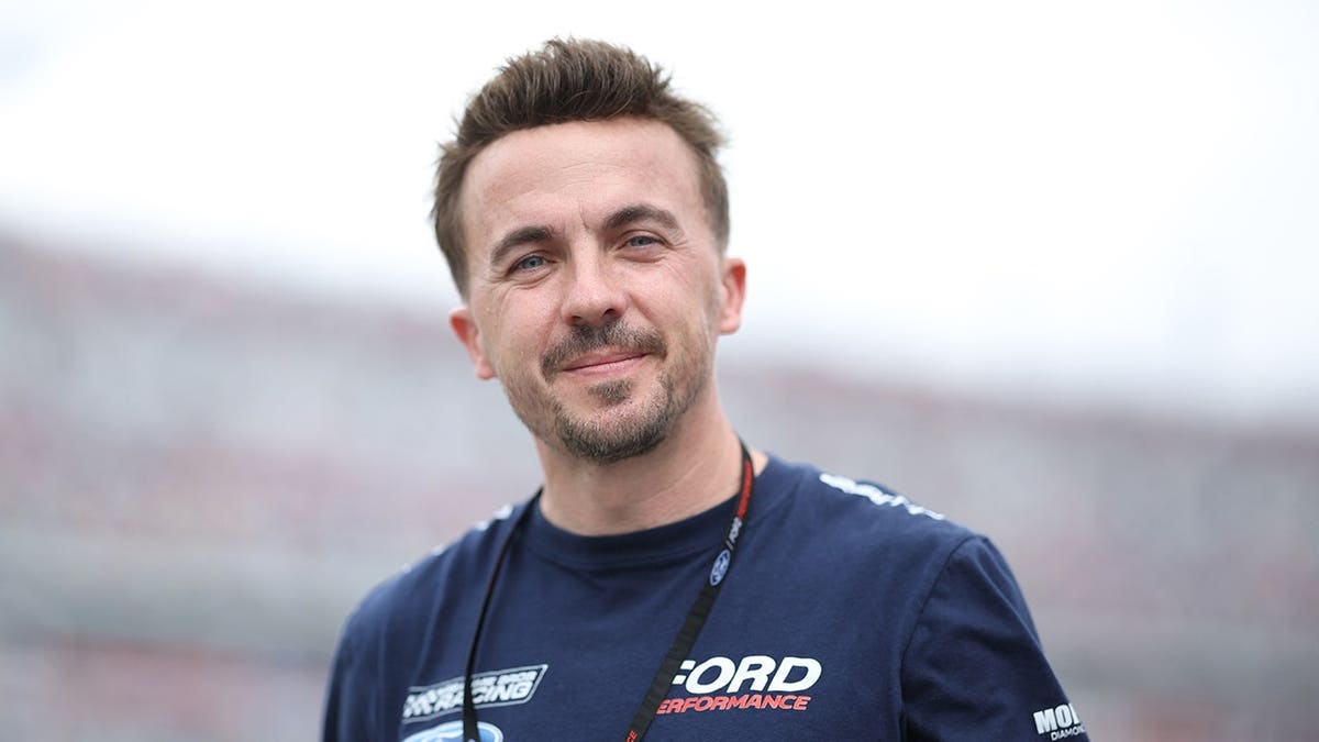 Frankie Muniz walks the grid at Daytona International Speedway prior to the Daytona 500.
