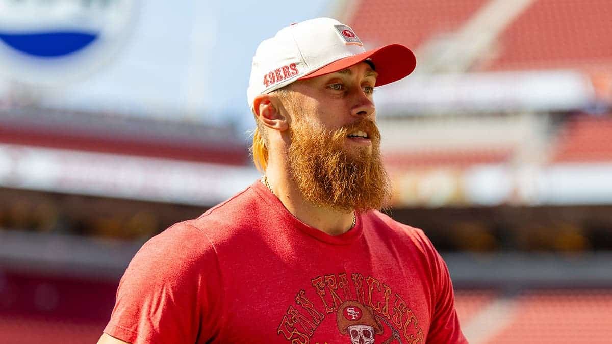 George Kittle walks on the field before a preseason game at Levi's Stadium.