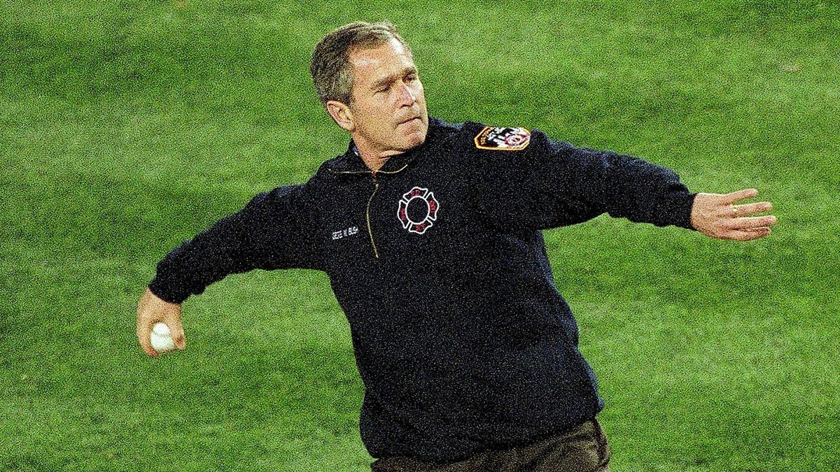 President George W. Bush throws out the first pitch before a World Series game.
