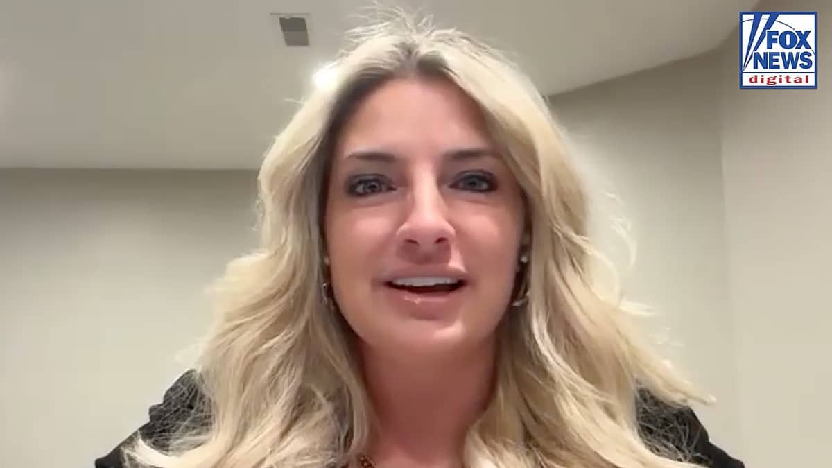 A woman with blonde hair in a Zoom video