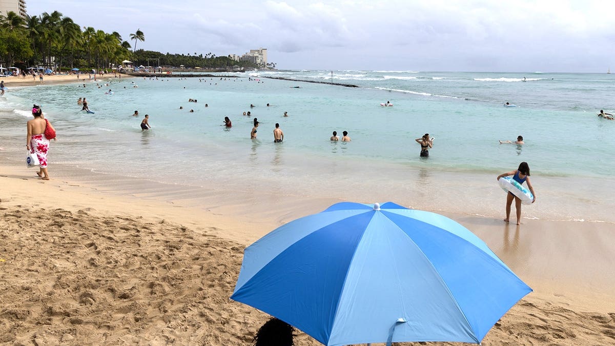 People on beach in Hawaii