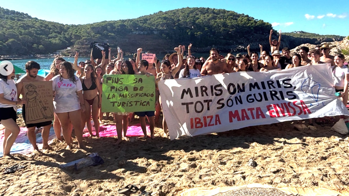 Ibiza protesters holding signs