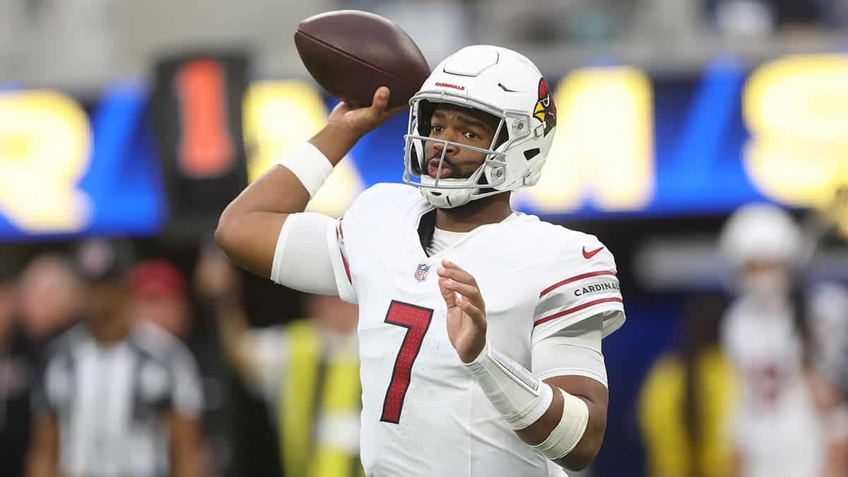 Jacoby Brissett passes the ball during an NFL game at SoFi Stadium.