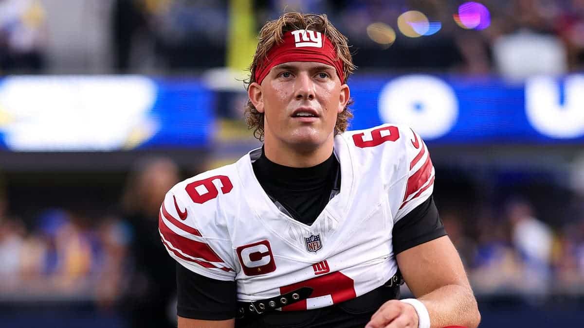 Jaxson Dart, No. 6, warms up before the Giants-Rams game at SoFi Stadium.
