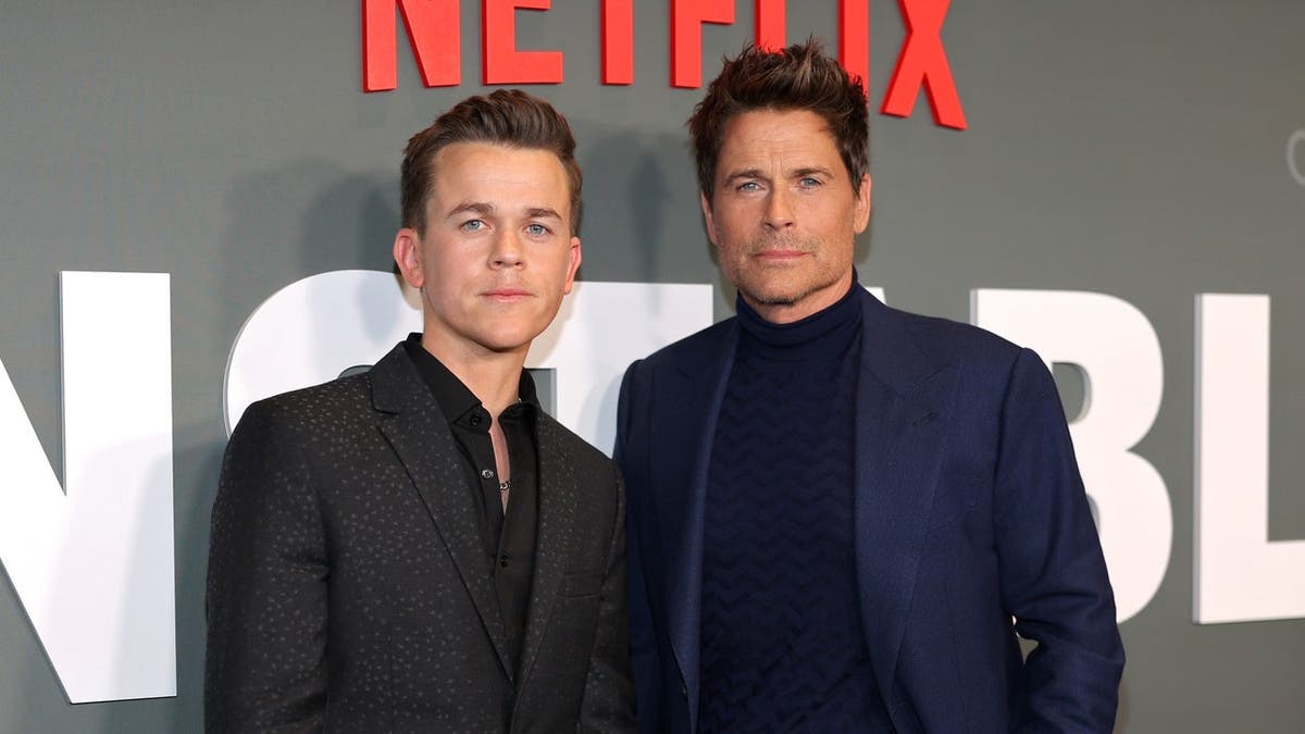 John Owen Lowe and Rob Lowe stand together at the Netflix Unstable season 1 premiere.