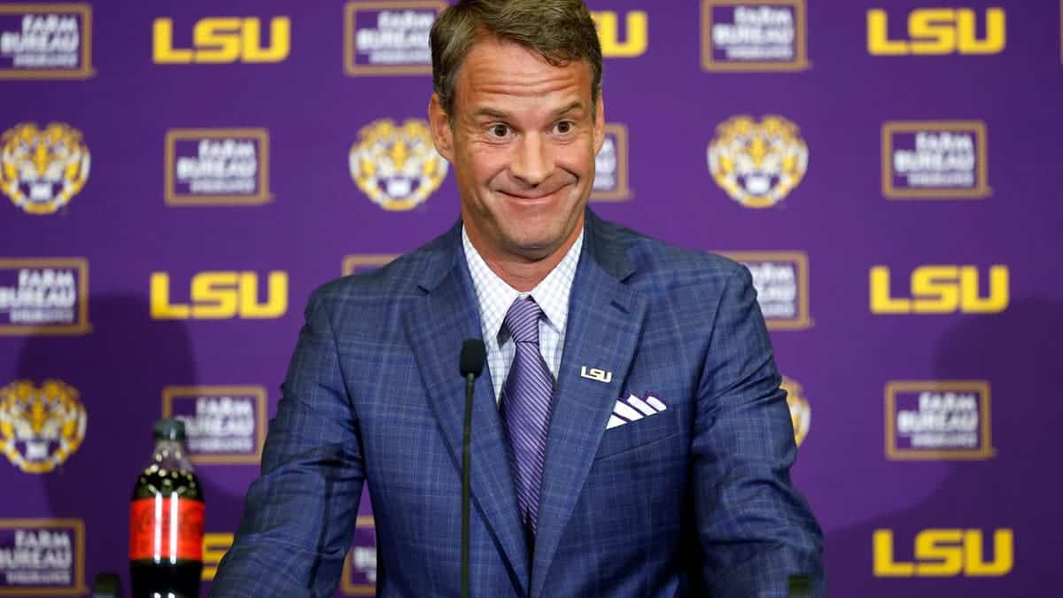 Lane Kiffin speaking at a press conference at Tiger Stadium in Baton Rouge, Louisiana