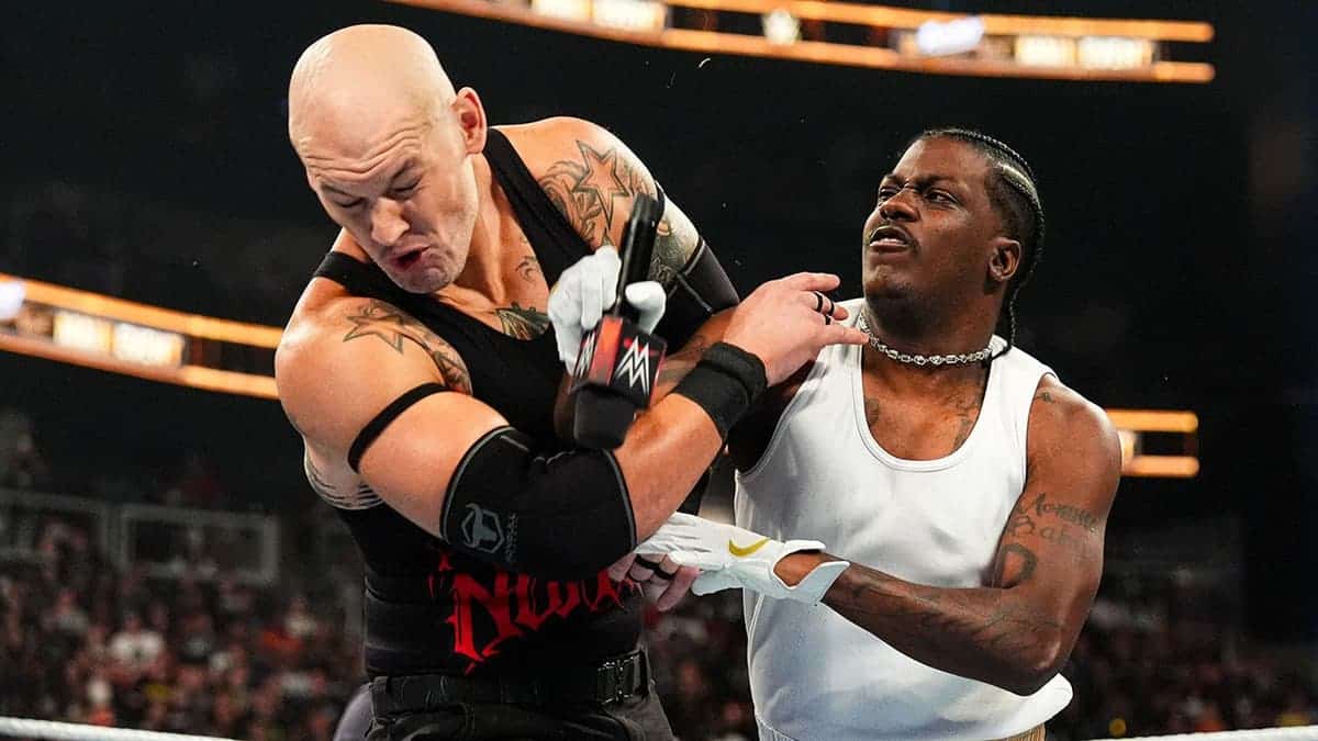 Lil Yachty in action against Baron Corbin during wrestling match at State Farm Arena.