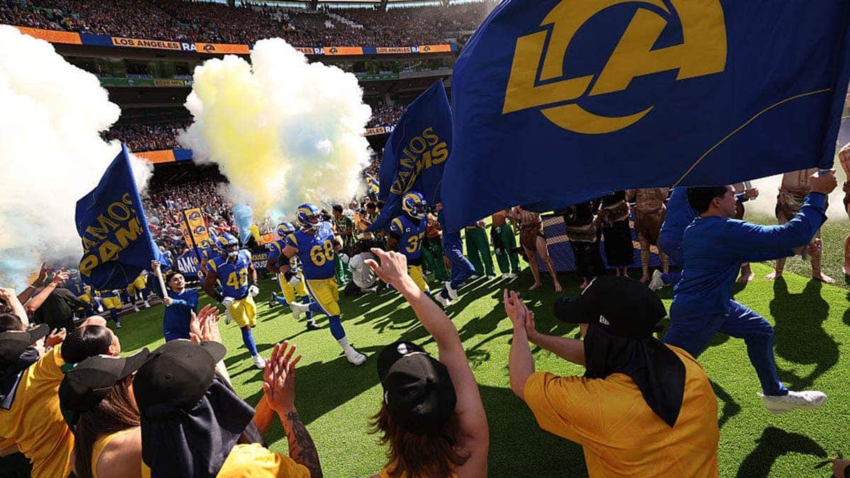 Los Angeles Rams players run onto the field before an NFL game in Melbourne, Australia.