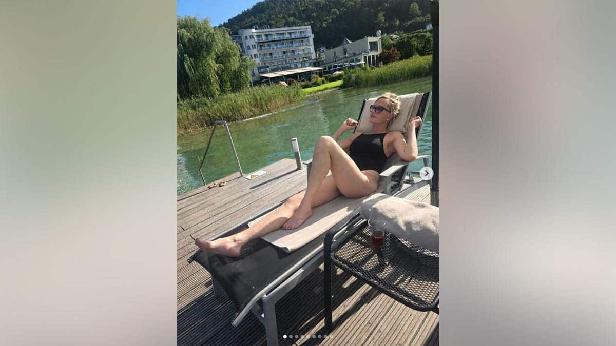 Melanie Griffith in a black swimsuit while in Austria.