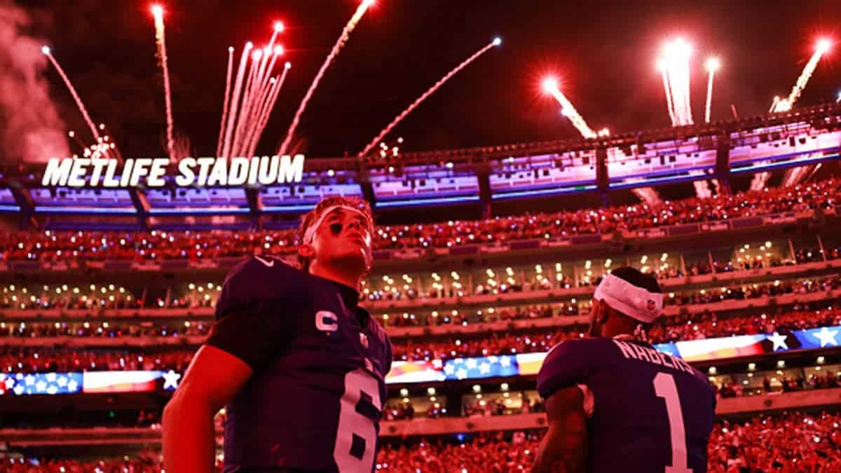 Jaxson Dart #6 and Malik Nabers #1 of the New York Giants watch fireworks at MetLife Stadium.
