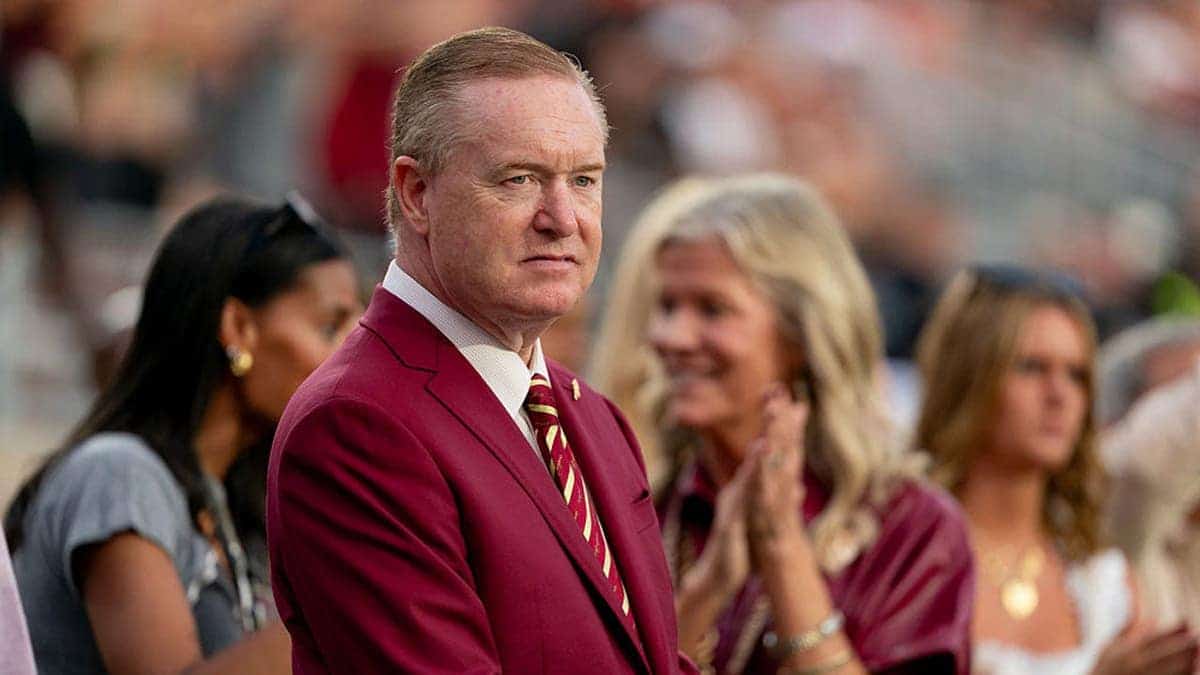 Michael Alford stands on the sideline before a college football game.