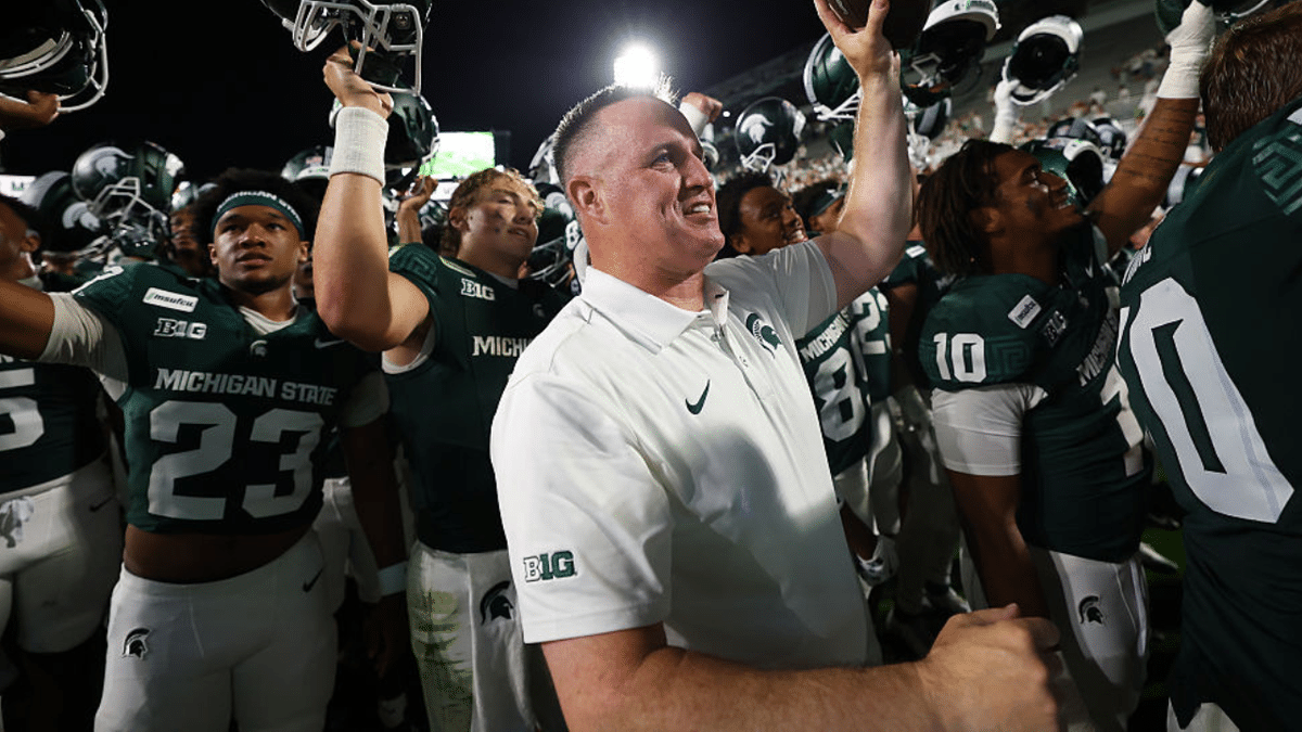 Pat Fitzgerald celebrates after Michigan State's 30-20 win over Toledo.