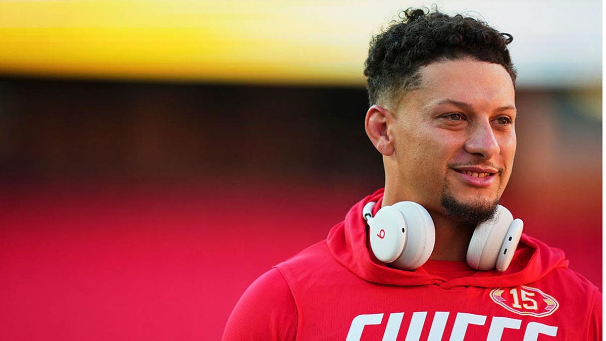 Patrick Mahomes #15 warms up before kickoff at Arrowhead Stadium.