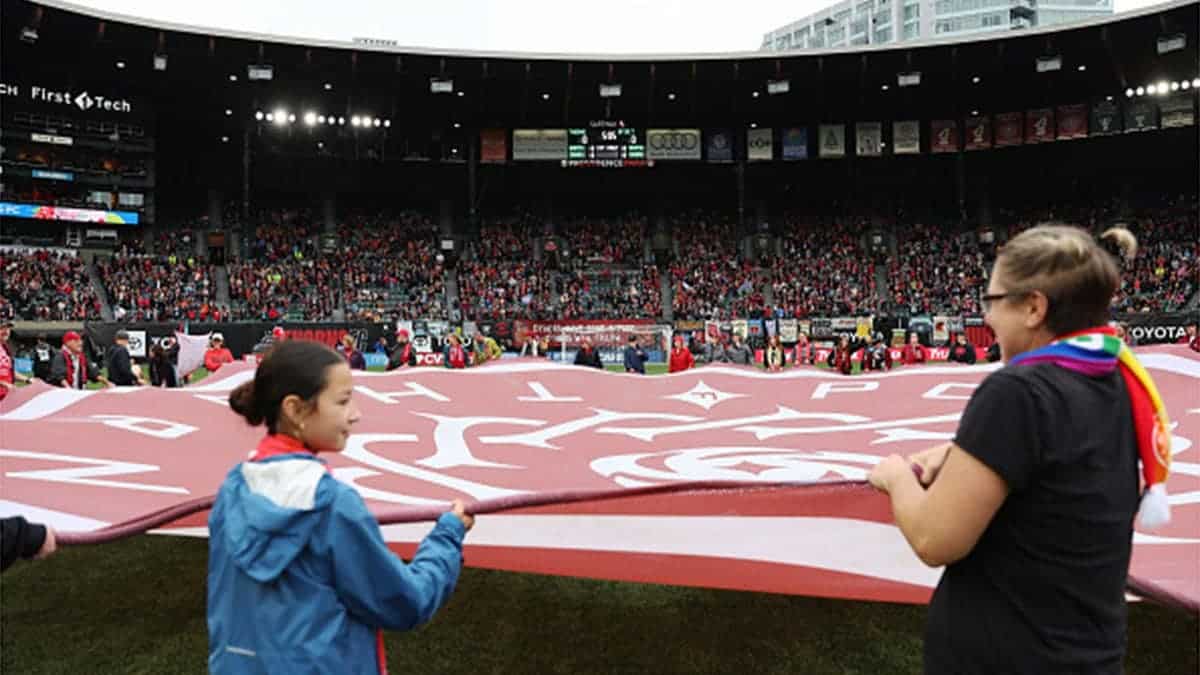 Stadium interior during national anthems before Portland Thorns FC versus Washington Spirit NWSL match.