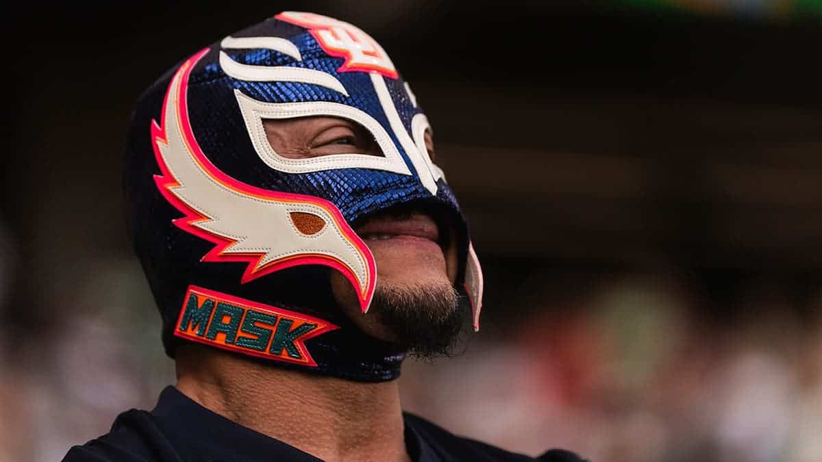 Rey Mysterio stands on the field before an MLB game at Estadio Alfredo Harp Helú.